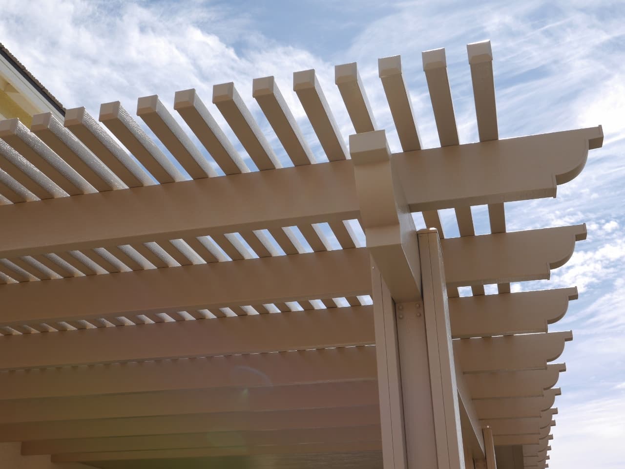 Solid-roof patio cover with recessed lighting
